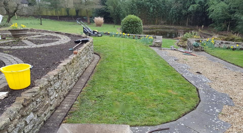 Reshaped lawn, curved edging.